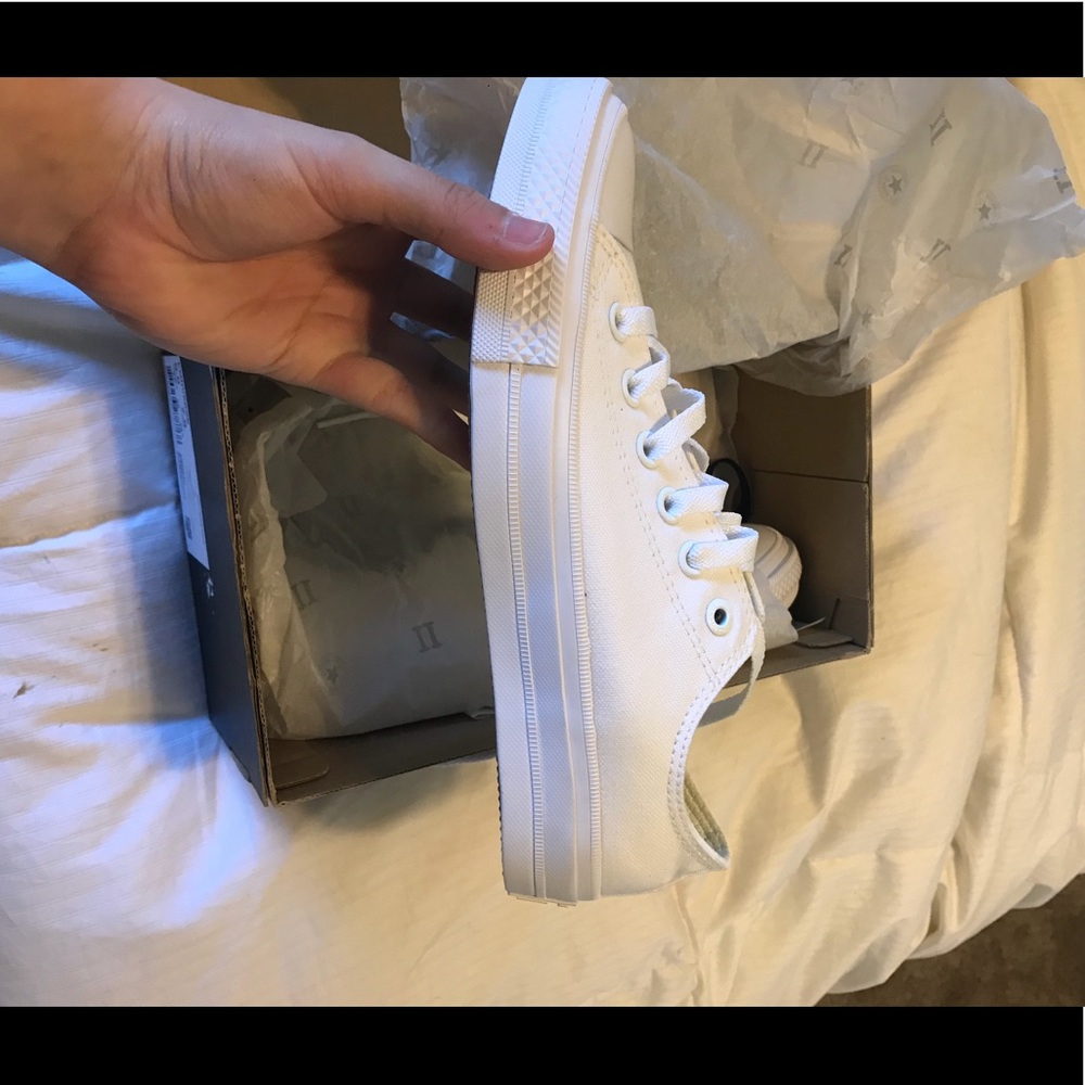 All white Converse lowtops